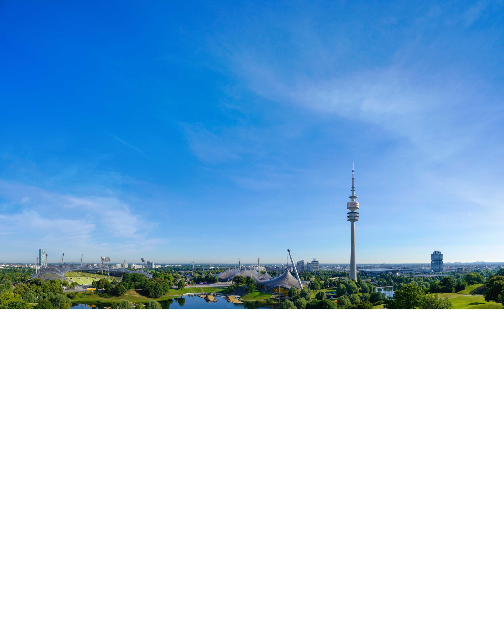 Die Skyline von München mit Blick auf den Olympiapark präsentiert den Hotspot der Werbeagentur.